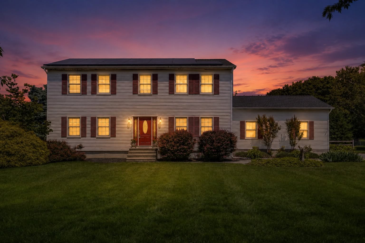 Virtual twilight example — colonial home exterior at simulated dusk