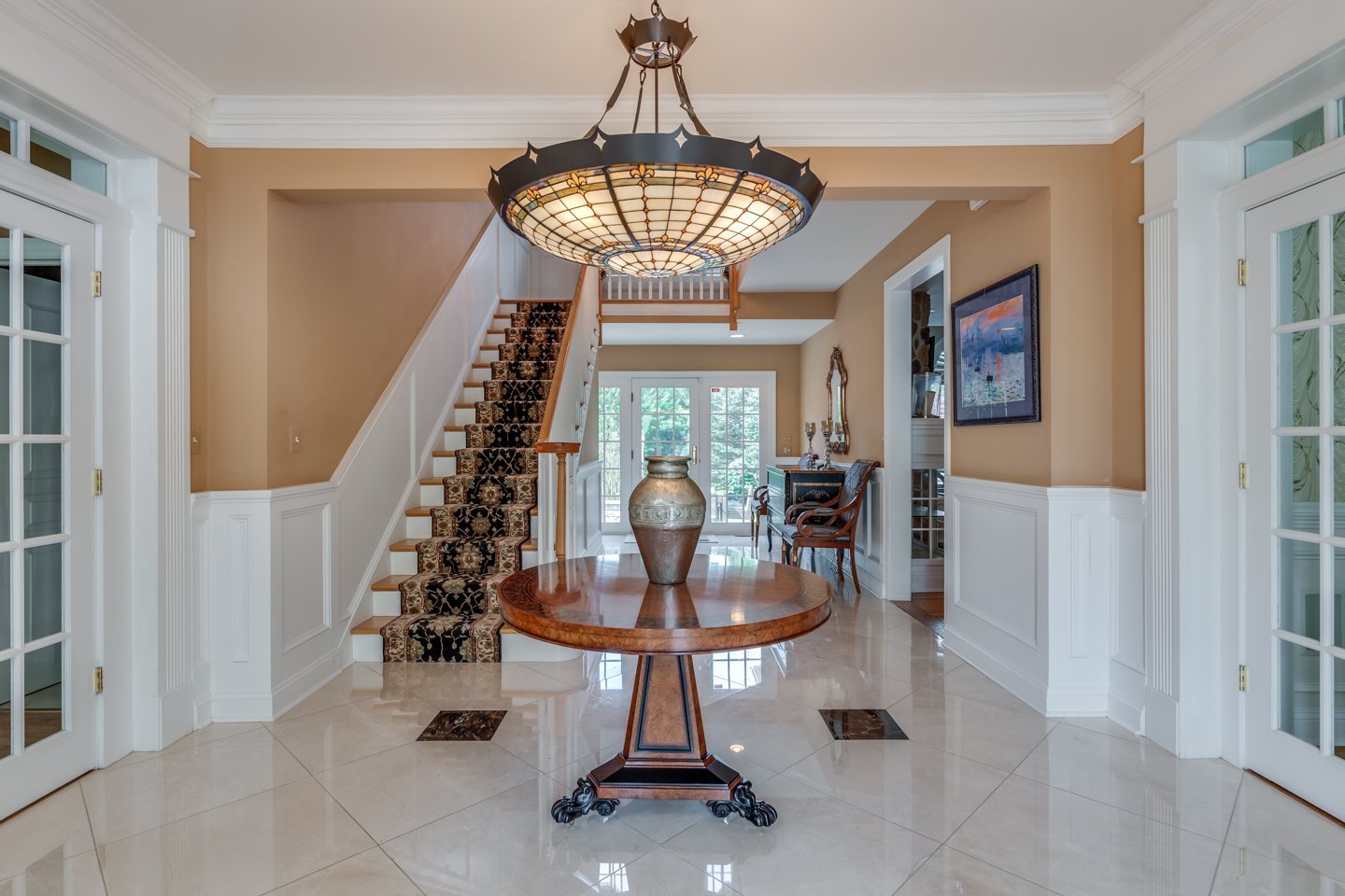 Grand marble foyer with Tiffany chandelier